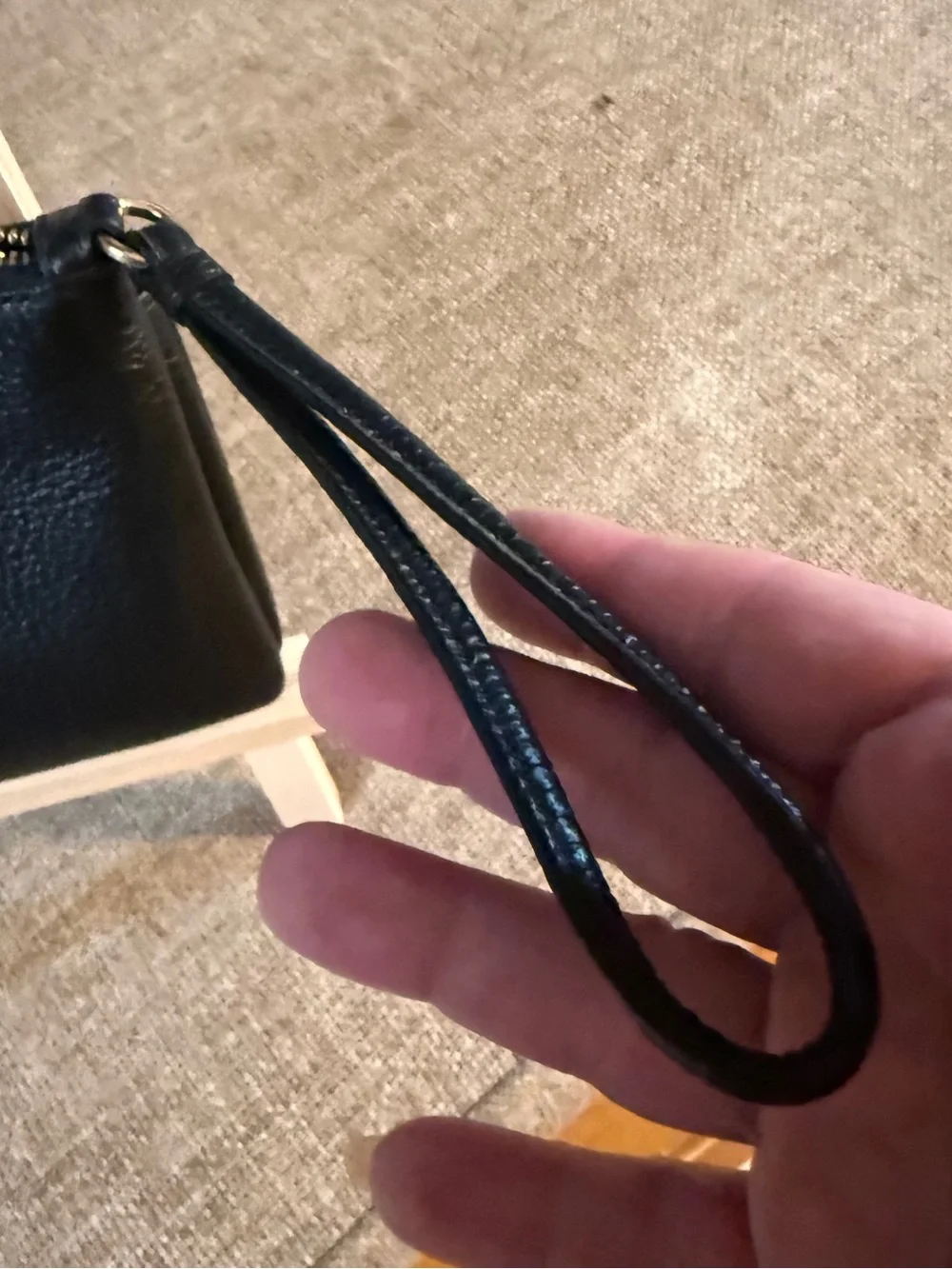 Coach Double Zip Wristlet crafted in black pebbled leather
